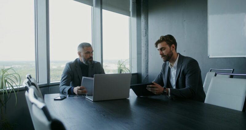 Professional meeting between partners discussing strategy for an e-commerce business in Delaware